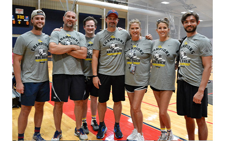 employees volleyball game group photo