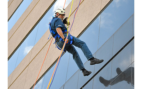 man on side of building